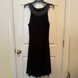 Elegant Black Sleeveless Dress with Embellished Neckline